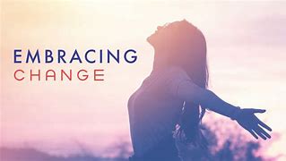 Woman with arms open to the sky beside the words Embracing Change